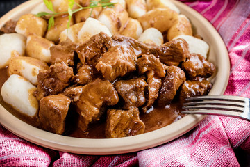 Beef stew with potatoes dumplings.