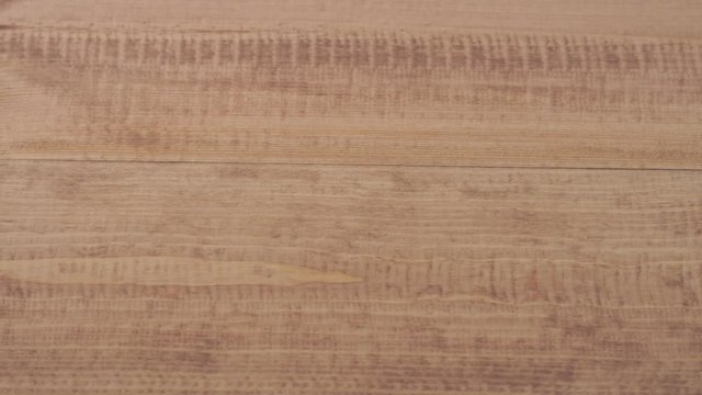 repair and decoration. the master applies an environmentally friendly coating on the wooden floor - natural oil wax dark