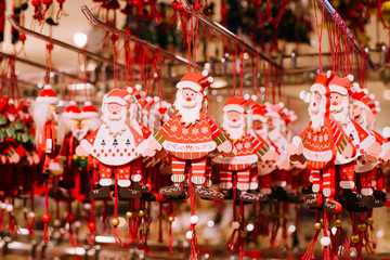 Naklejka premium New year market. Set of holiday decorations and christmas tree toys hanging at new year trade fair shop window.
