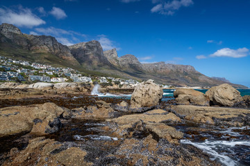 Camps Bay coast with the The Twelve Apostles mountains on the background.