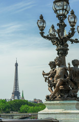 Fototapeta na wymiar The statue of the Alexander III Bridge and the Eiffel Tower