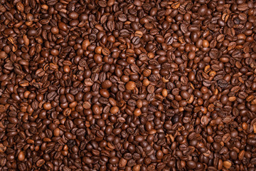 Fresh roasted coffee beans background. Overhead view.