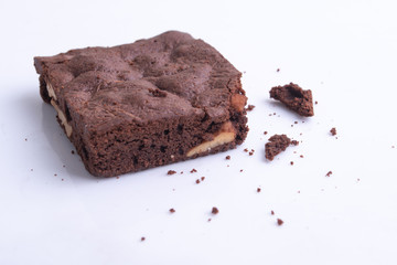 brownies with macadamia nuts on white background