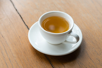 Hot tea cup on wood table