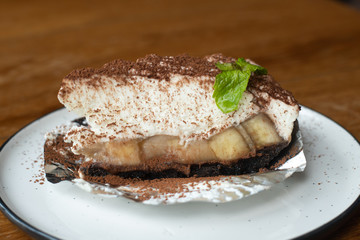 Banoffee pie with bananas, whipped cream, chocolate,