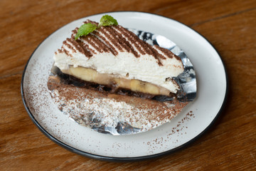 Banoffee pie with bananas, whipped cream, chocolate,