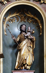 Saint Joseph holding baby Jesus, altar in Our Lady church in Aschaffenburg, Germany