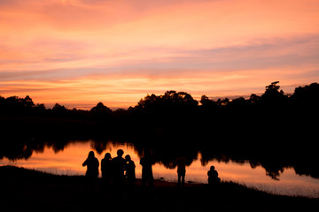 silhouette of people at sunset