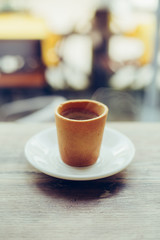 cup of fresh espresso on table.Hot coffee in paper cup with copy space for your text. Coffee to go.coffe break in cafe.coffe team.