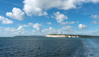 Fototapeta na wymiar English Channel off the Dorset coast, England, UK with a view of the Old Harry Roaks and white cliffs close to Swanage.