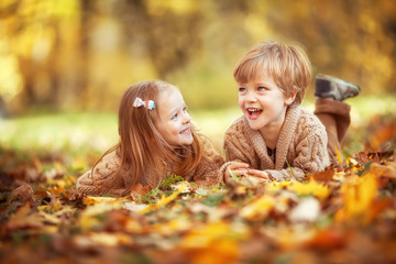 Funny twins in autumn park - 291704442