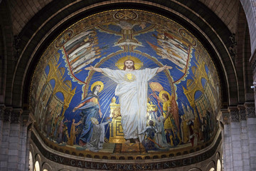Christ in Majesty is surrounded by the Virgin Mary, Joan of Arc and St. Michael, mosaic by Luc-Olivier Merson, Basilica of the Sacred Heart of Jesus in Paris.