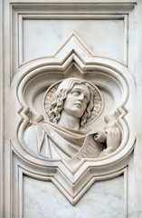 Fototapeta na wymiar Joel prophet, relief on the facade of Basilica of Santa Croce (Basilica of the Holy Cross) - famous Franciscan church in Florence, Italy