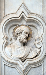 Saint, relief on the facade of Basilica of Santa Croce (Basilica of the Holy Cross) - famous Franciscan church in Florence, Italy