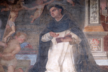 The lunette of one of the side doors depicting St. Thomas Aquinas, detail of the facade of the...