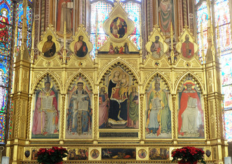 Fototapeta na wymiar Madonna with the Child and the four Doctors of the Church - Polyptych of the high altar in the Basilica di Santa Croce (Basilica of the Holy Cross) - famous Franciscan church in Florence, Italy