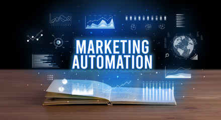 MARKETING AUTOMATION inscription coming out from an open book, creative business concept