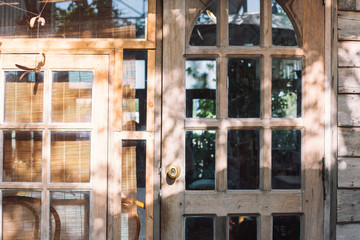 old wooden door and window with sun light
