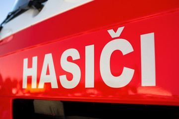 Hasici (translation from Czech: firemen) - Detail of red fire truck - public service of firefighters and rescuers in Czech Republic.