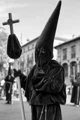 Holding a cross in a procession, Holy Week