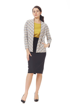 brunette business woman in checkered offical jacket and midi skirt high heels black shoes full body photo