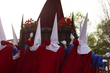 Rear view of hood penitents in a procession, Holy Week