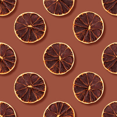 Dried grapefruit and orange fruits. Seamless pattern, red background