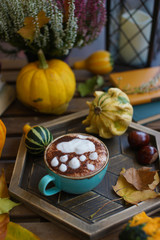 Cup of coffee with cinnamon on an open table