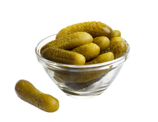 pickled cucumbers gherkin in a glass bowl isolated on white background