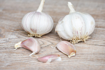 Garlic Cloves and fresh garlic bulb on wooden background forherbs and spices ingredients spicy