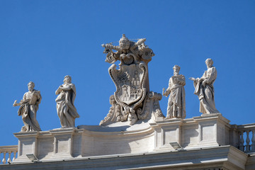 Obraz premium St. Mark Evangelist, Mary of Egypt, Alexander VII Coat of Arms, Ephraim and Theodosia of Tyre, fragment of colonnade of St. Peters Basilica. Papal Basilica of St. Peter in Vatican, Rome, Italy. 