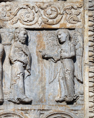 Angel appeared to Joseph in a dream to tell him to flee to Egypt, medieval relief on the facade of Basilica of San Zeno in Verona, Italy