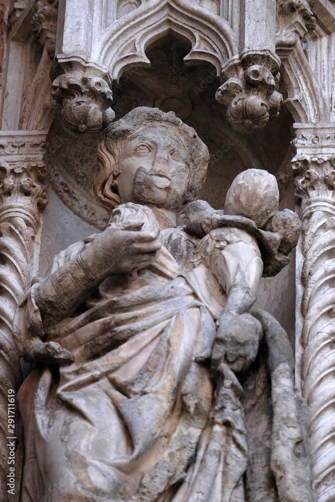 Wall mural statue on the porta della carta, detail of the doge palace, st. mark square, venice, italy