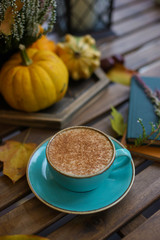 Obraz na płótnie Canvas Cup of coffee with cinnamon on an open table
