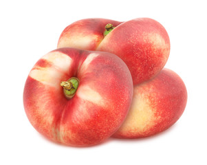 Composition with juicy flat nectarines isolated on white background.