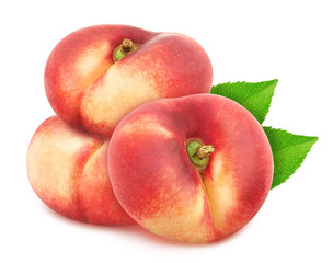 Group of ripe sweet donut nectarines with leaves isolated on white background.