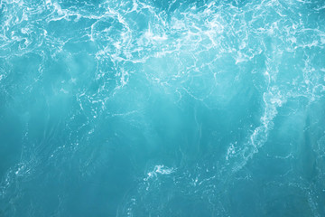 Sea  Waves in ocean wave Splashing Ripple Water. Blue water background.  Leave space to write a...