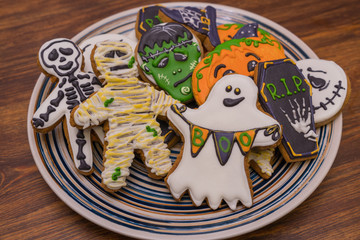 Plate with festive Halloween cookies for party