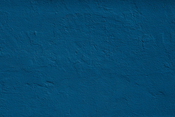 Navy blue colored dark Concrete textured background with roughness and irregularities to your design or product. Color trend concept.