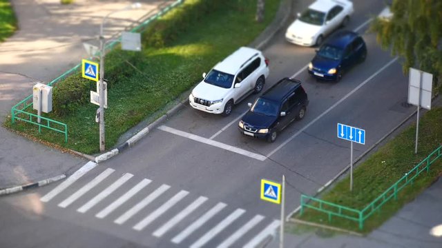 City with houses and cars, top view, timelapse.