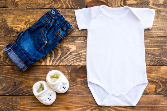 Mockup Of White Baby Bodysuit Shirt, Slippers And Jeans