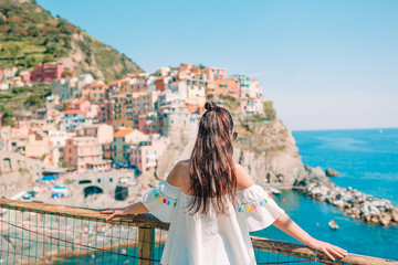 Fototapeta na wymiar Tourist looking at scenic view of Manarola, Cinque Terre, Liguria, Italy