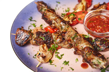 Kebab with garnish and sauce