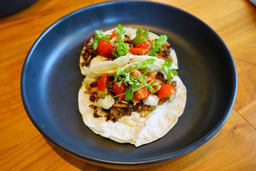 Fototapeta na wymiar Plate of delicious vegan tacos