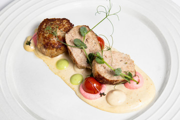 Meat balls with sauce on a white plate