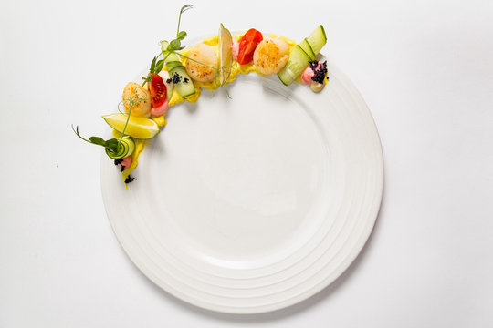 Fried scallop  on a white plate