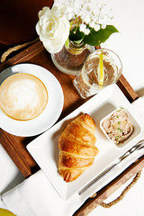 Breakfast croissant and coffee