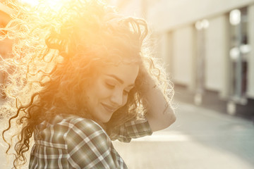 Woman face. Girl beautiful hair smiling at camera looking confident running enjoying urban city lifestyle real people series. Slow motion 4K.