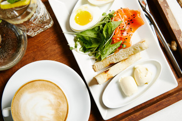 Breakfast egg, toast, salmon and coffee