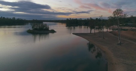Aerial Dusk view of Mina de Sao Domingos, Tapada Grande River Beach lagoon, famous tourist destination, Alentejo, Portugal.